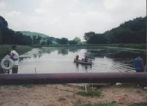 3 teens in a canoe on Lake DeVonne