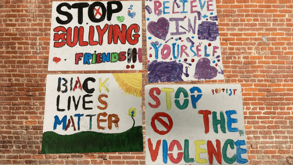 image of four advocacy signs created by students for CSL projects
