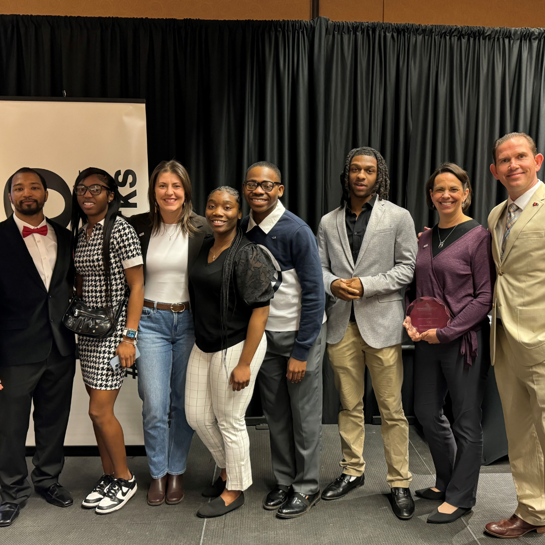 group of students and adults posing for the camera
