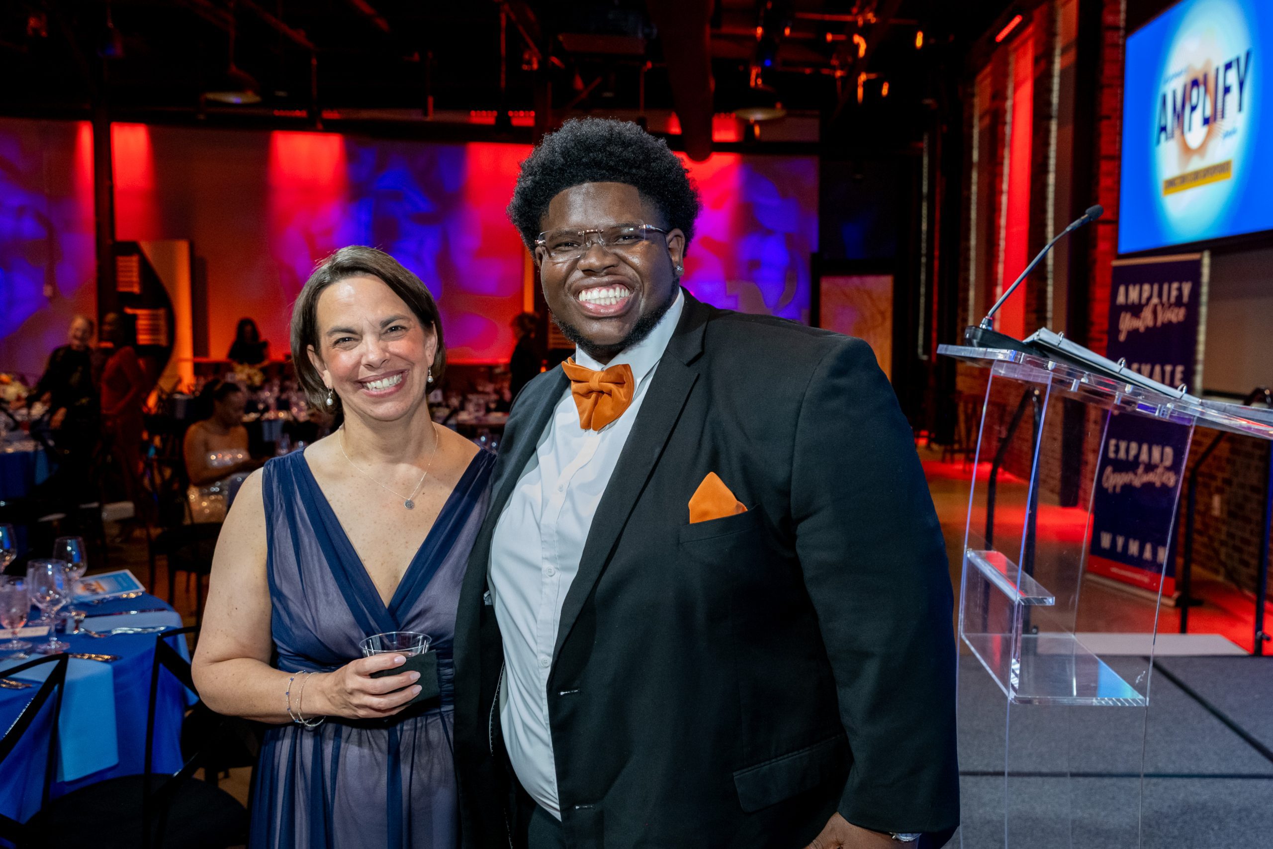 picture of teen and staff posing for camera at event